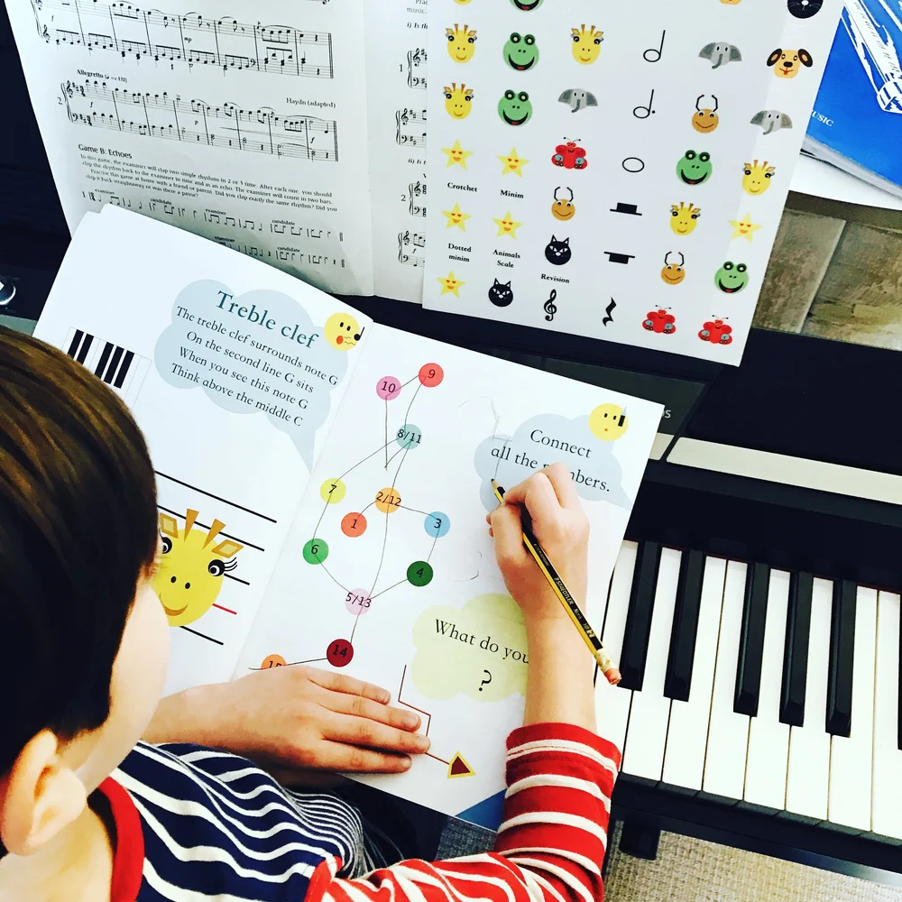 Child completing a music theory activity